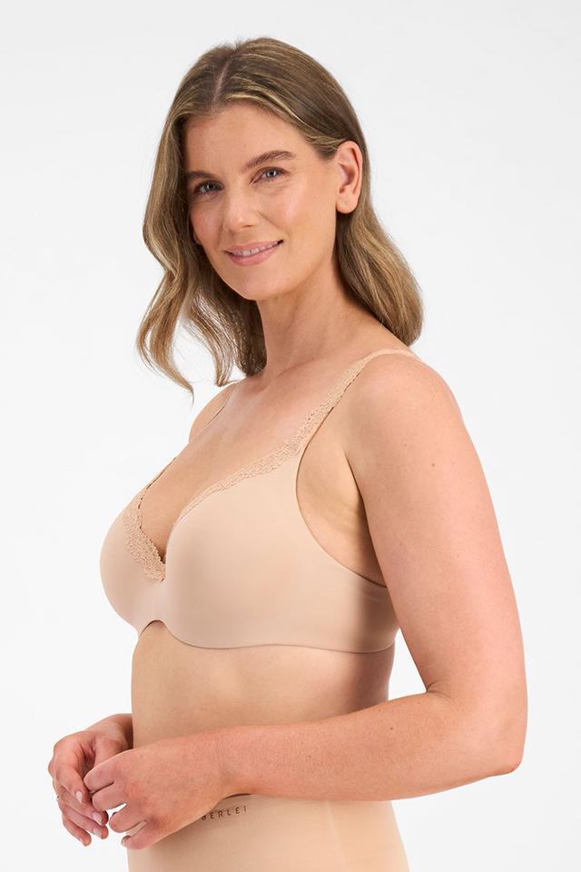 CLARYSSA (She/Her) wears size 14DD and is 181cm tall with 94cm chest and 79cm waist