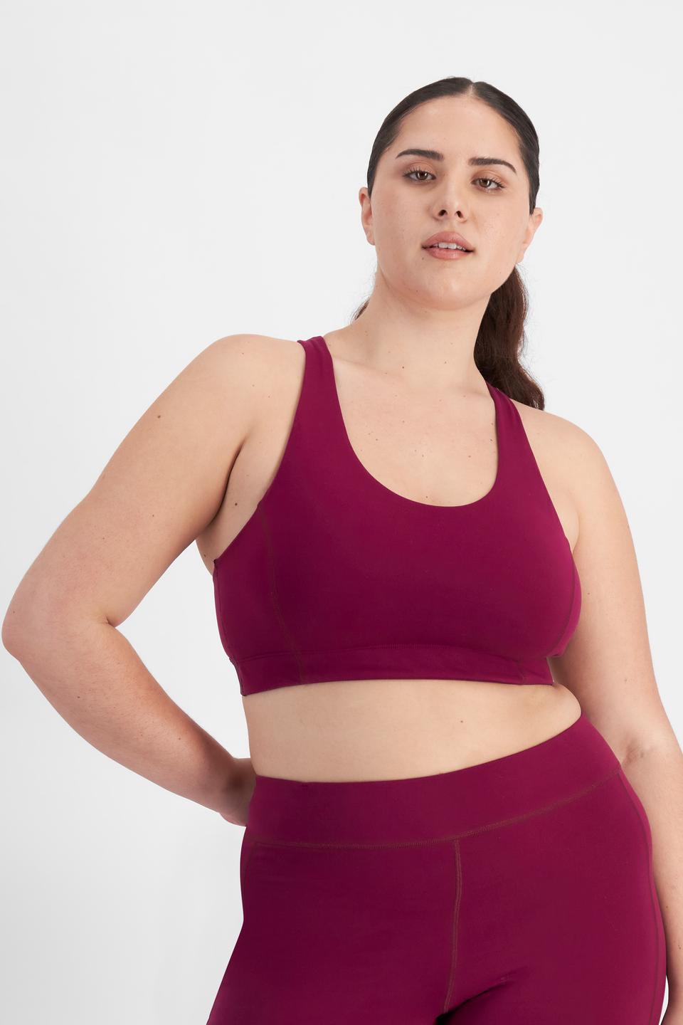 Bella (She/Her) wears size 14D and is 173cm tall with 95cm chest and 77cm waist